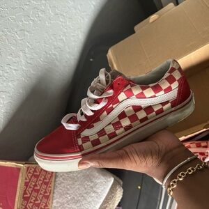 Red and white low top vans